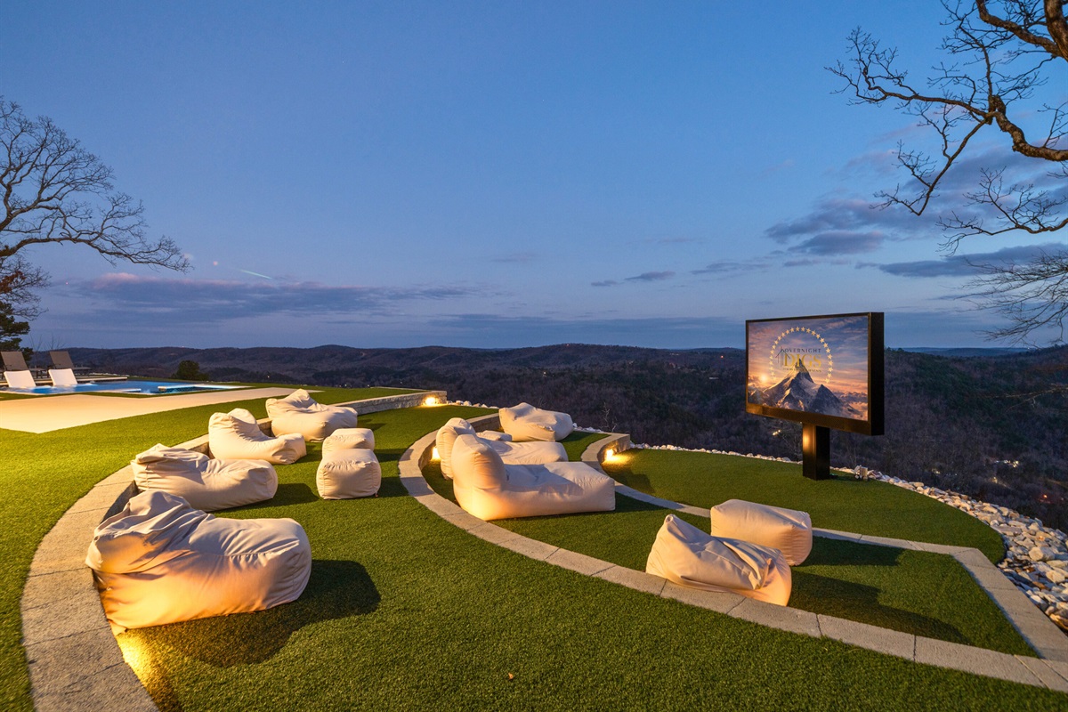 Outdoor movies hit different here, with comfortable seating, a nearby fire pit, and the perfect setup for long conversations under the trees.