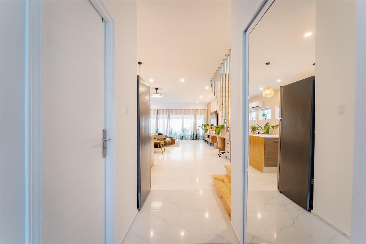 Secure smart lock access leads into a bright, welcoming foyer