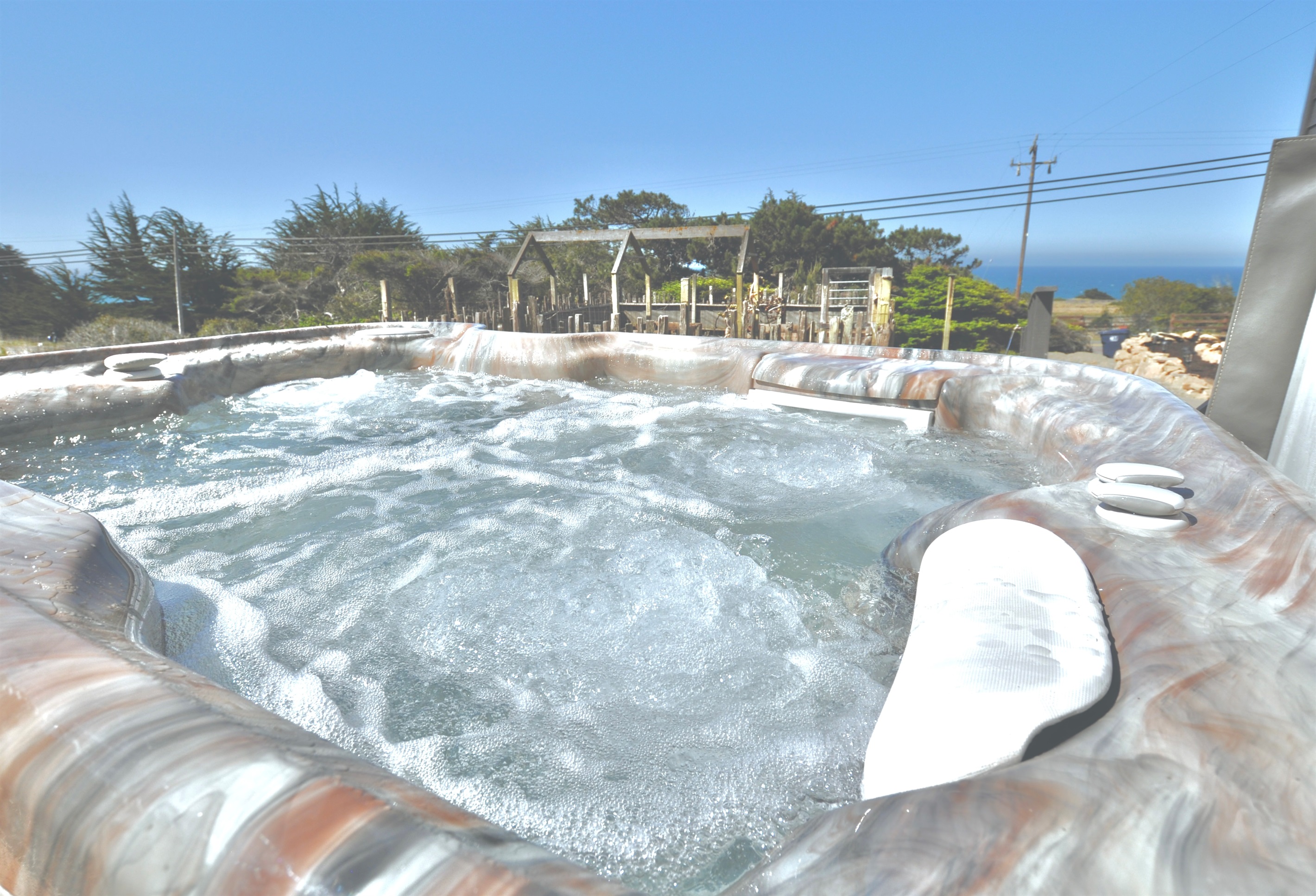 The private, secluded ocean-view hot tub is reserved only for you, tucked away from public view. The hot tub uses salt as a sanitizer and is serviced after each guest's stay.