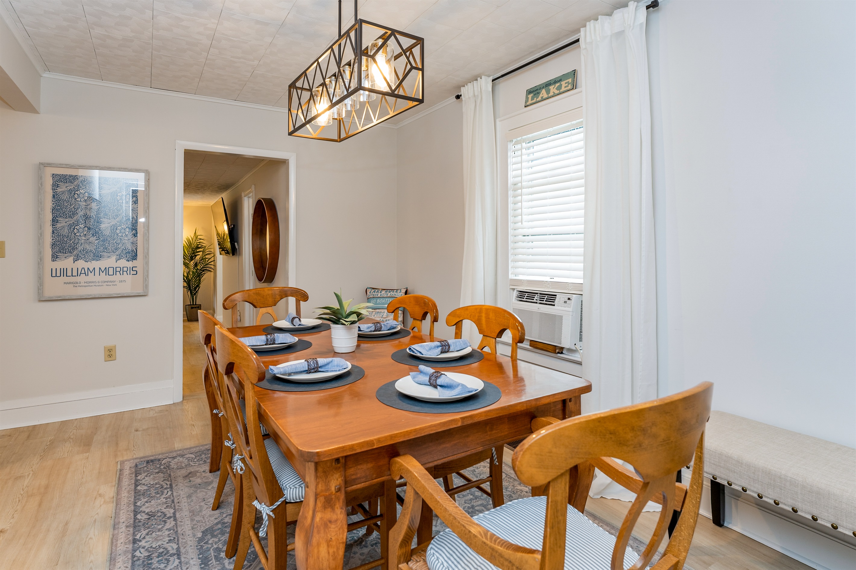 Open-concept dining area seamlessly connects to the cozy living space, ideal for both intimate dinners and lively group gatherings.