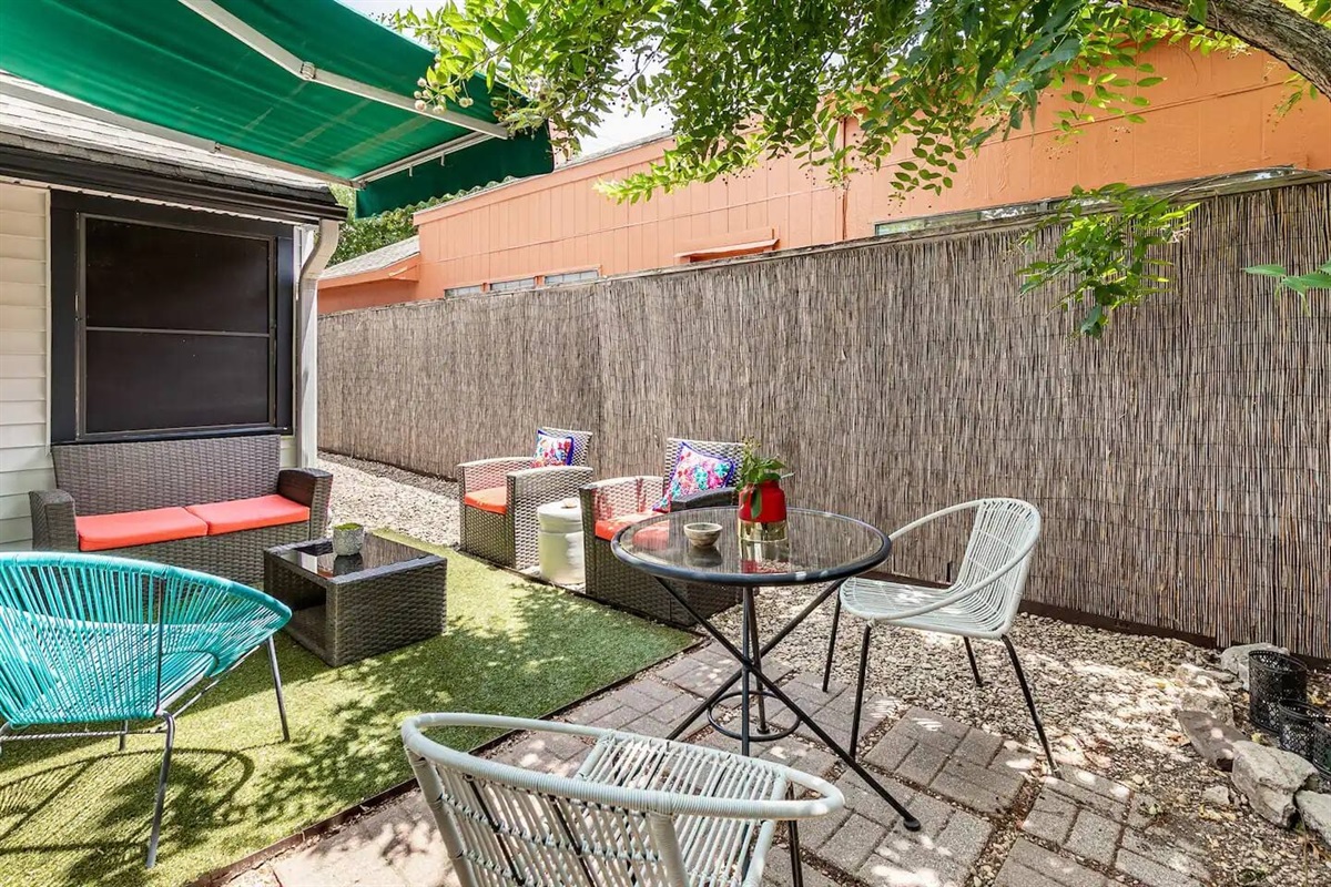 Spacious backyard with privacy fence and lawn.