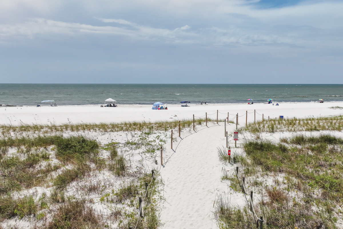 Take the sandy path to the beach and enjoy easy access to beautiful white sand, Gulf waters, and unforgettable coastal sunsets