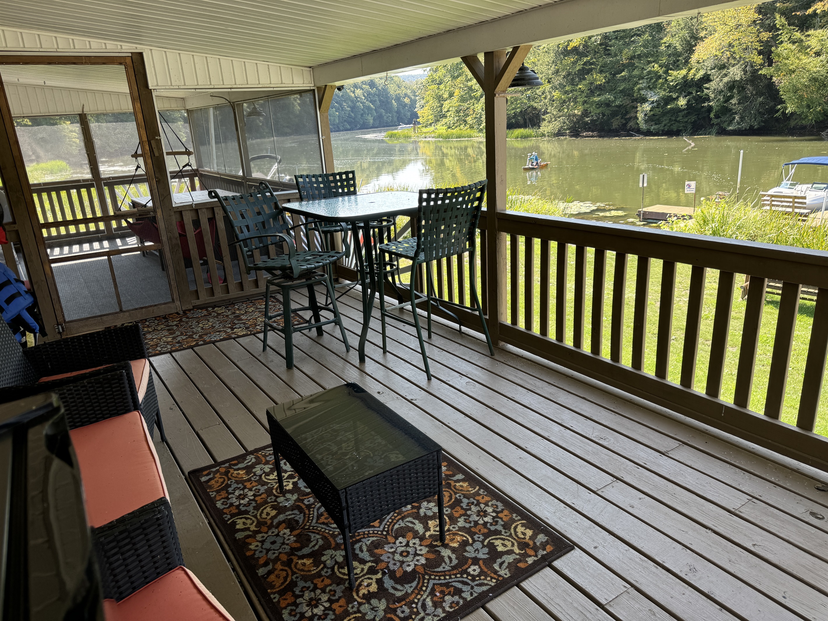 Covered back deck overlooking the water