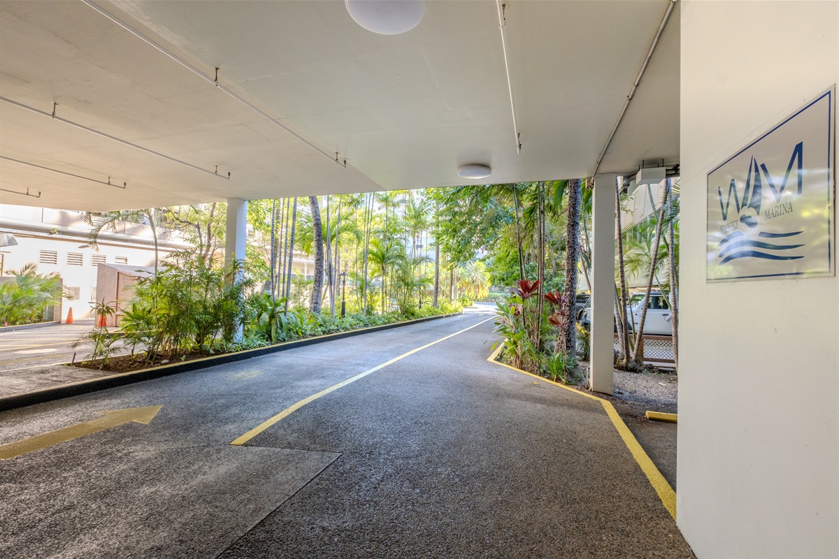 Arrive in paradise with ease — this tropical entryway welcomes you to the Waikīkī Marina, surrounded by lush palms and island greenery. A peaceful start to your stay, just moments from beaches, shops, and the vibrant heart of Honolulu.