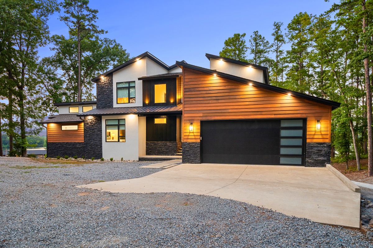Sleek modern exterior with a welcoming glow—Firefly awaits your arrival.