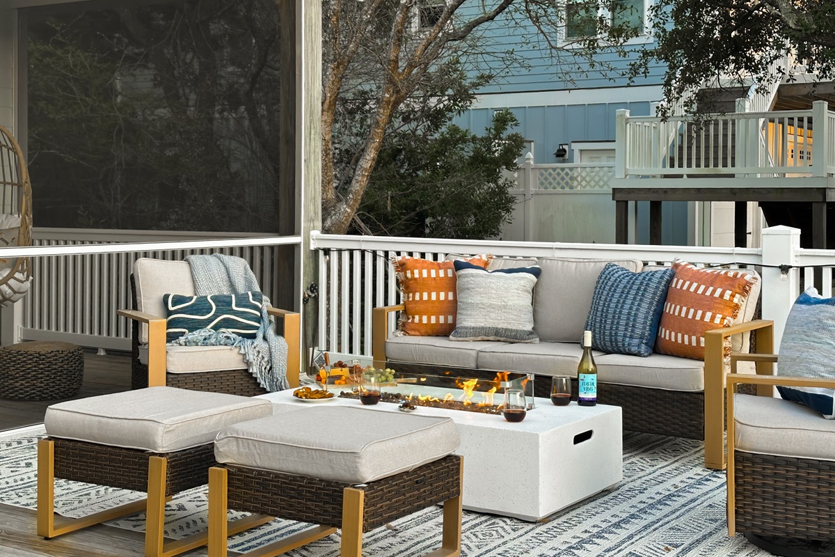 The fire table is surrounded by a cozy seating area.