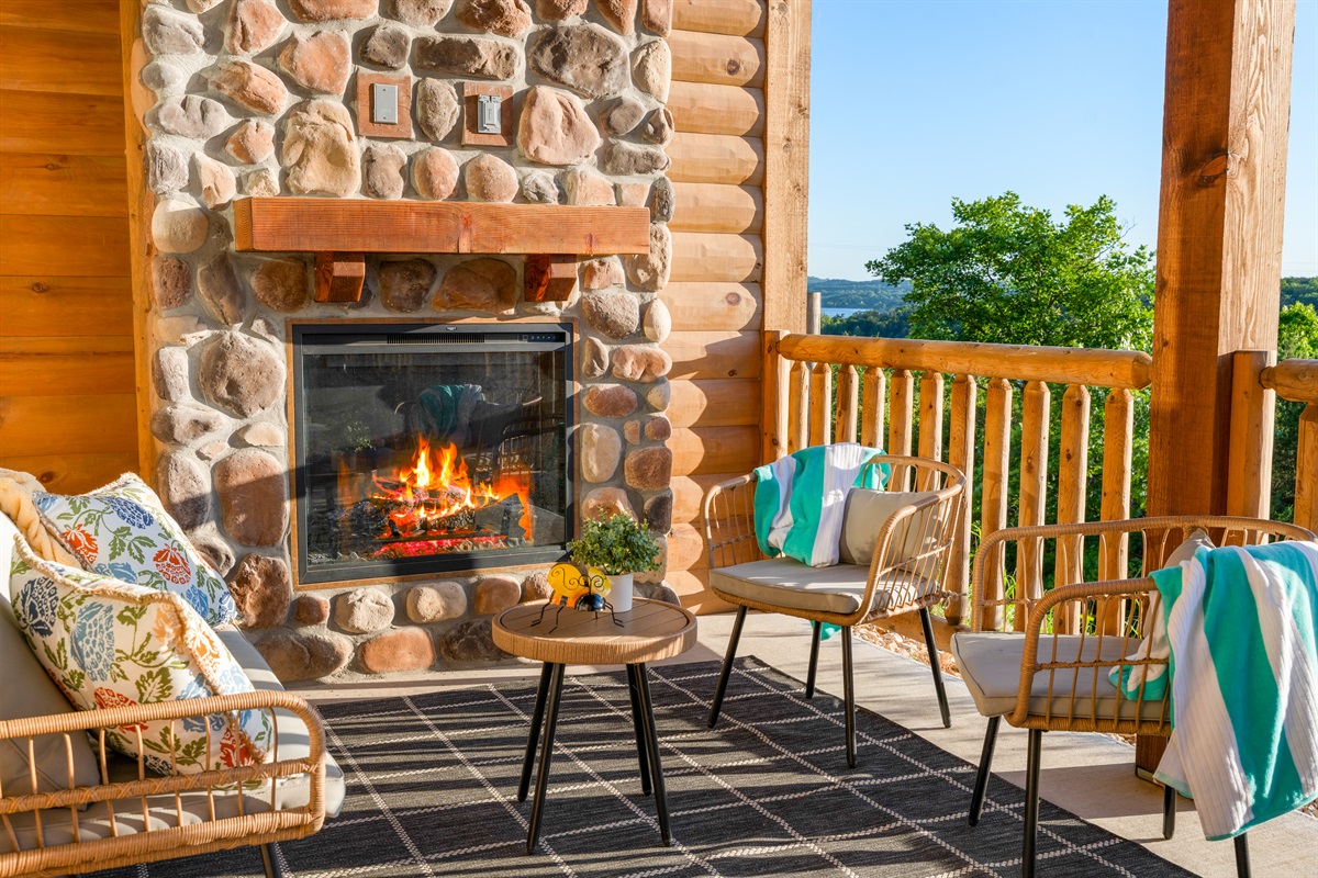 Cozy up to the stone outdoor fireplace any time of year.