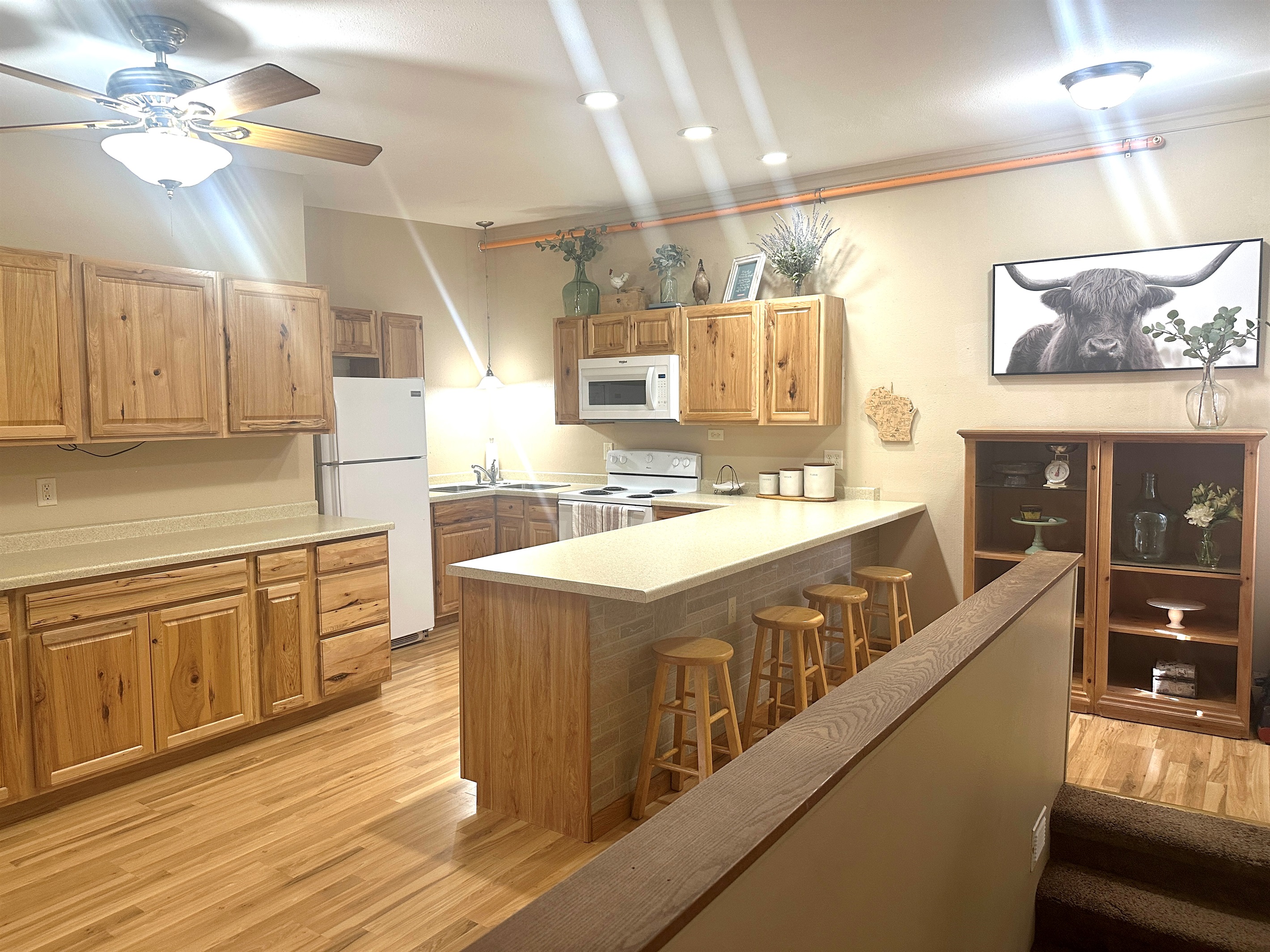 The large kitchen is fully stocked for all your cooking and gathering needs.