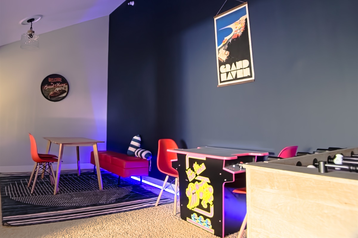 Game room with Foosball, arcade, and board games