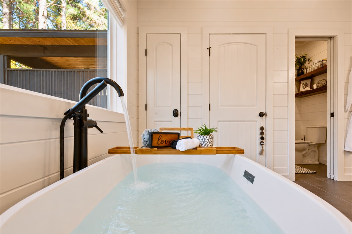 End the day with a quiet bath, soft lighting, and the peaceful sounds of nature surrounding your private couples retreat.