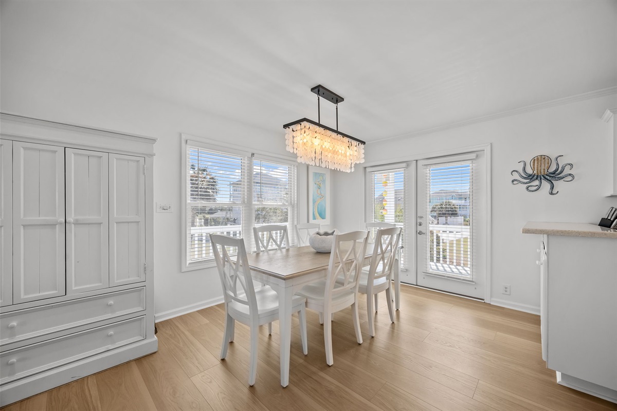 Bright dining area with seating for family meals and easy access to the balcony