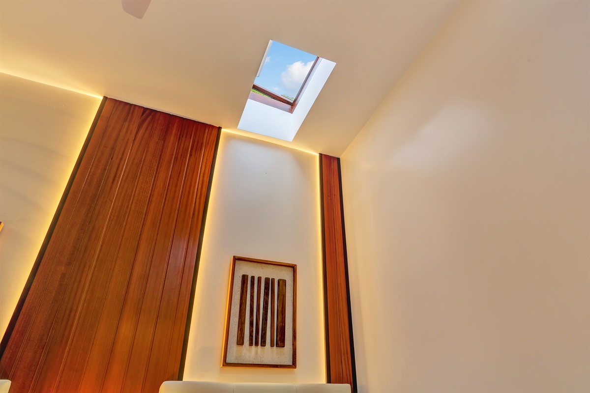 Second bedroom with a skylight that brings in natural light, creating a bright and pleasant atmosphere.