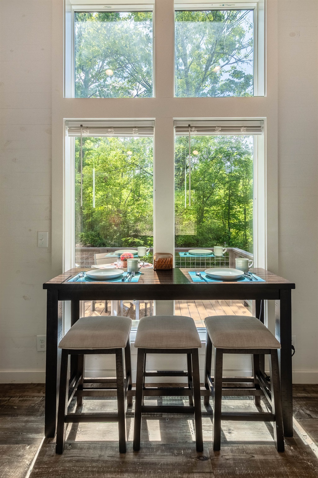 Gather at the counter-height table for meals, games, or coffee with a view of the front yard.