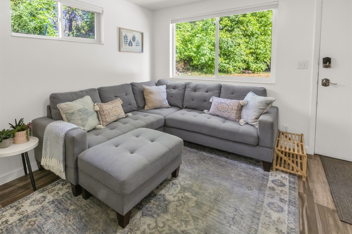 Bright and cozy living room with large windows