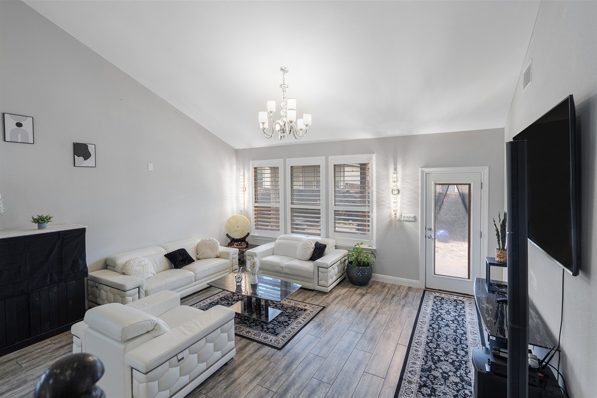 🛋 Living Room  “Cathedral ceilings, leather seating, and vibes that feel like vacation.”