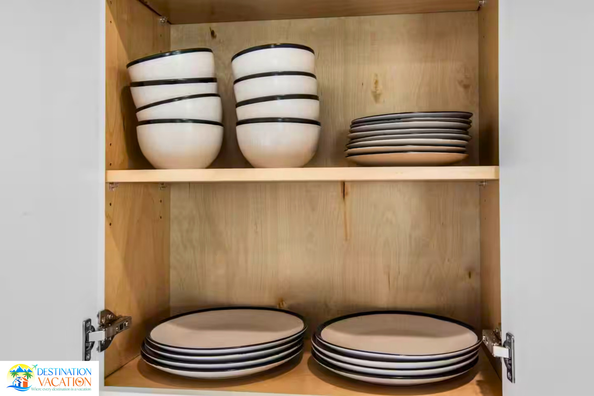 Beautifully arranged dinnerware adds thoughtful coastal charm.