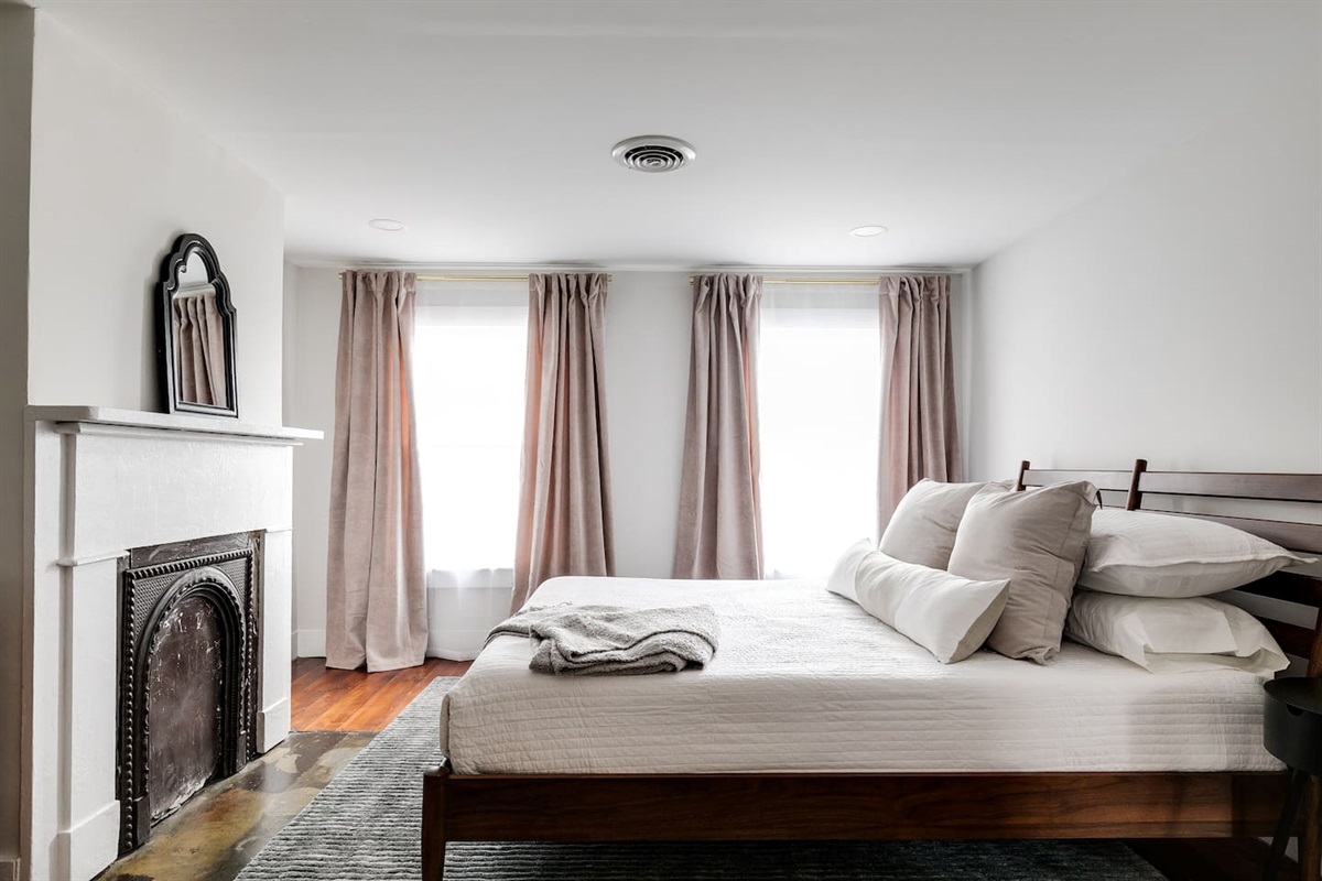 2nd Floor Queen Bedroom: Bright and inviting retreat with elegant decor and soft, natural light!