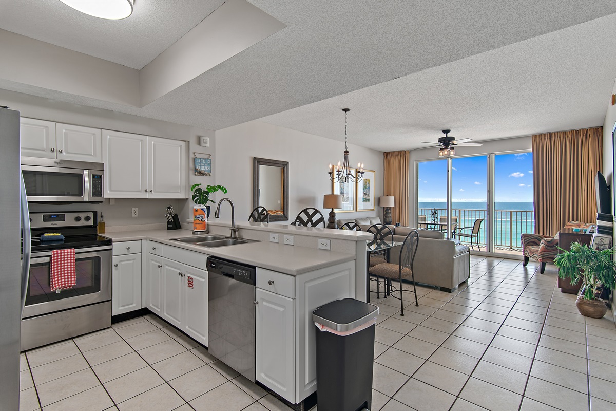 Kitchen has GULF VIEWS and stainless appliances - fully stocked with more than the basics (coffee/tea bar, oils/salt and pepper, Tupperware, plenty of pots/pans/cookware)