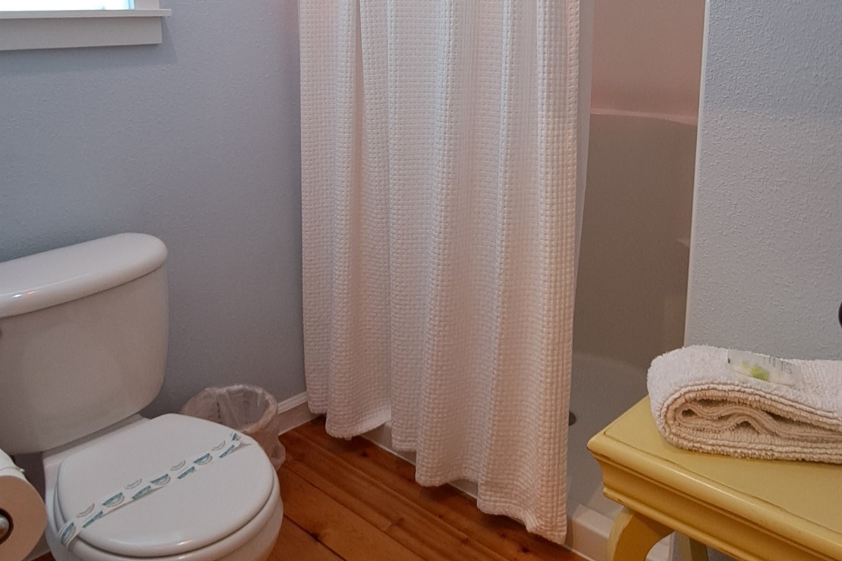 A dedicated shower room enhances the master suite, blending convenience with privacy.