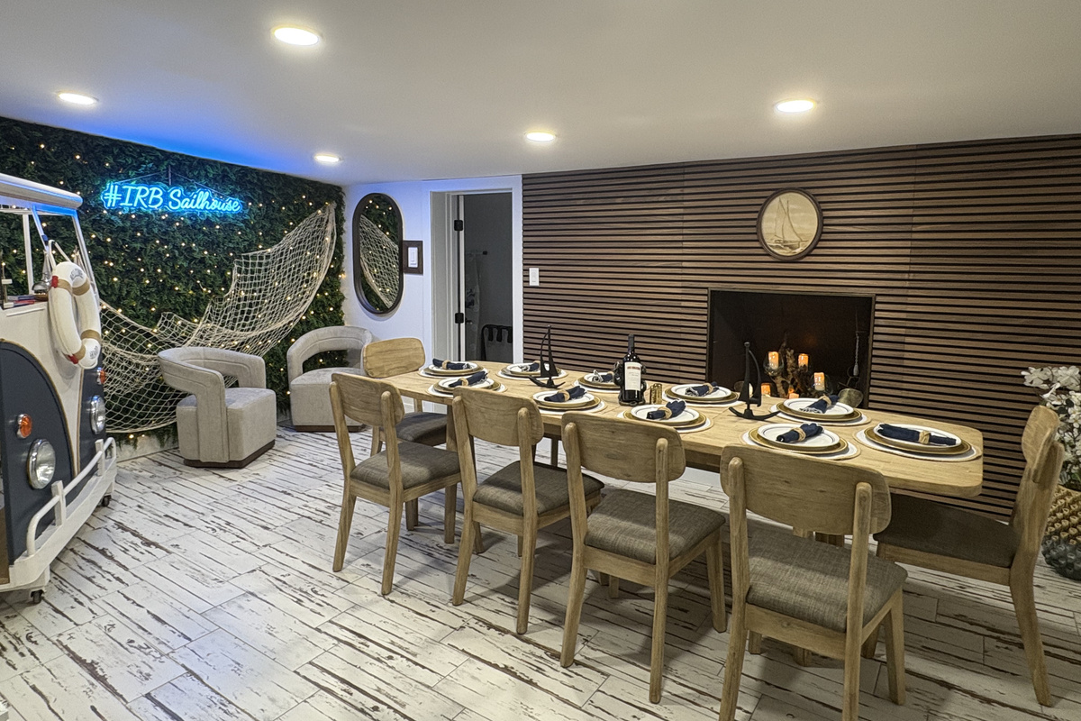 Large open Coastal inspired dining room with a photo moment and ample seating for your group.