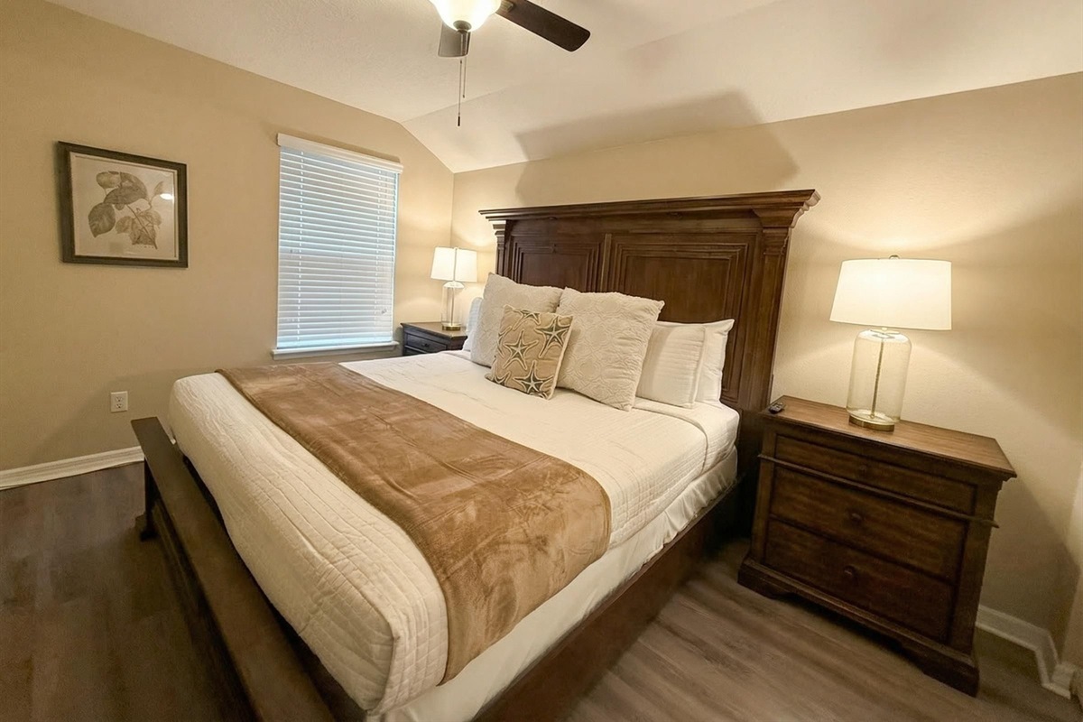 Relaxing bedroom retreat with king bed and soft lighting.