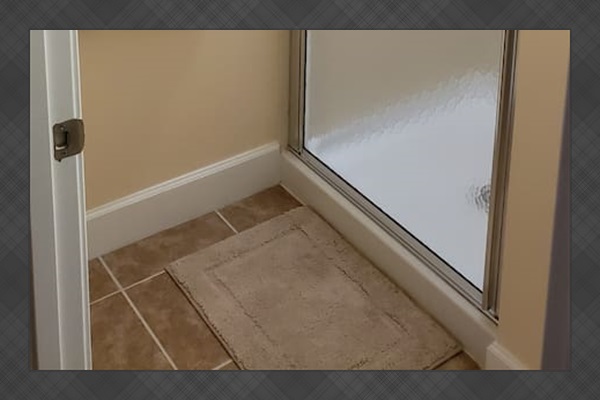 Bathroom next to bunk beds 