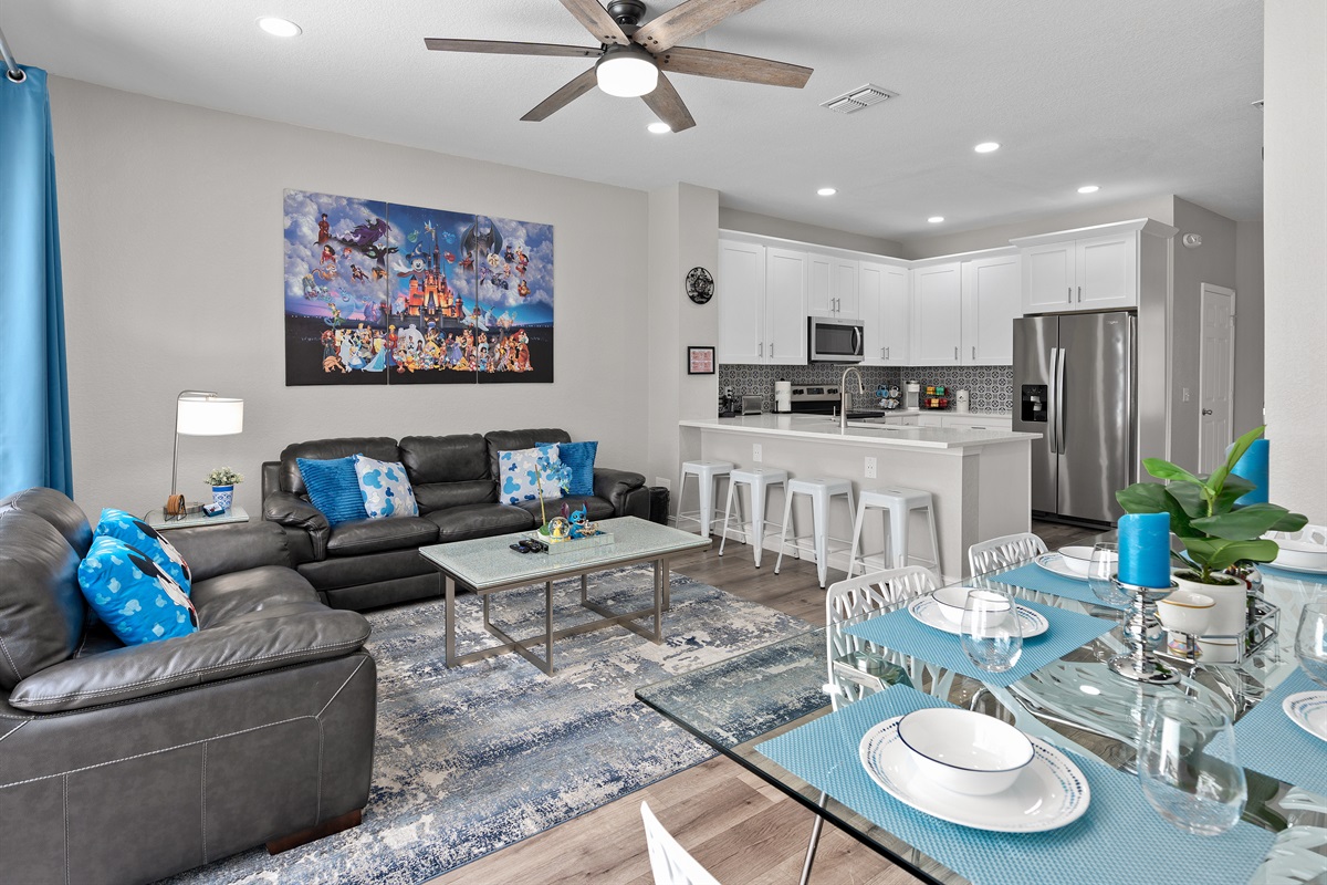 Open-concept living room flowing into fully equipped kitchen at Belle’s Villa