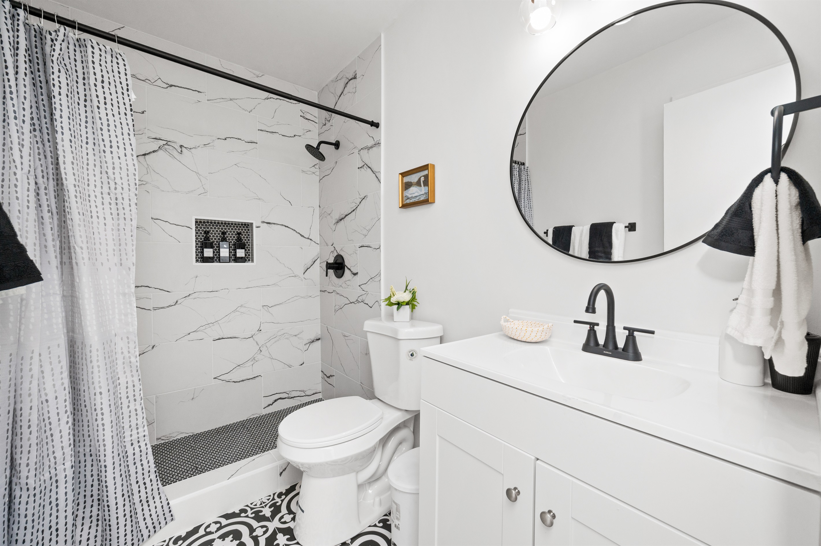 Luxe, white washed bathroom with stand alone shower and modern design