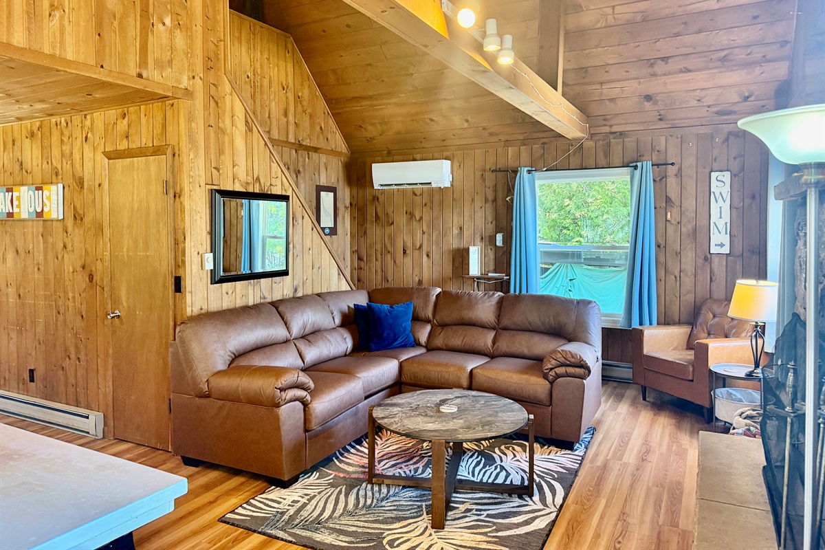 Living Room with fireplace and lake views
