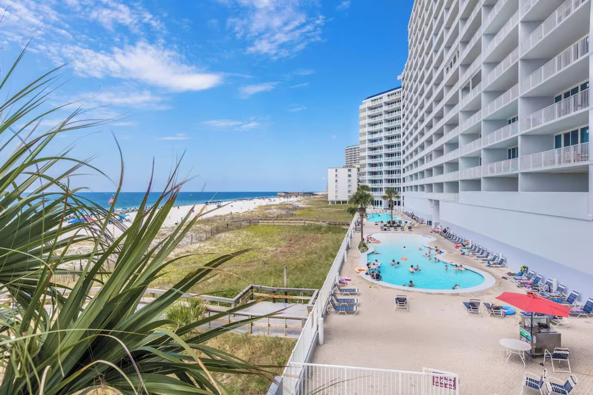 Outdoor pool area has 2 pools and 2 hot tubs