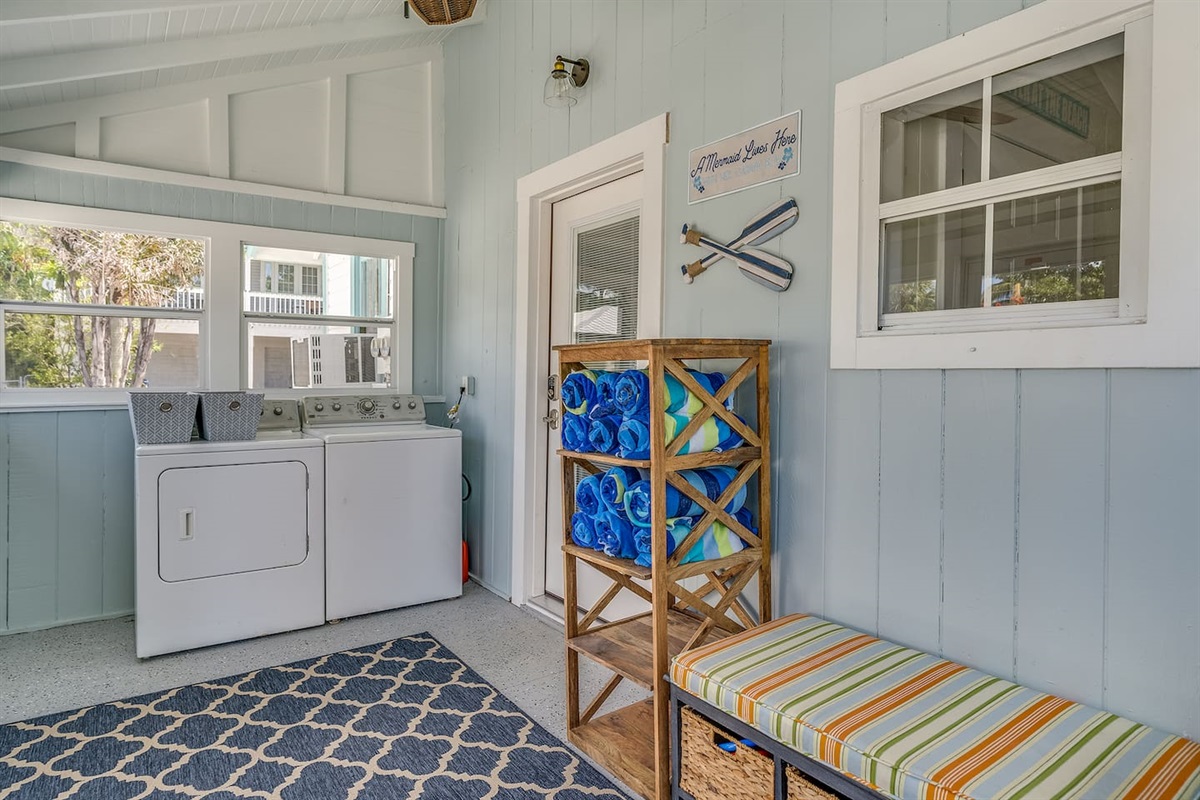 Large glassed in porch with screens & laundry room.