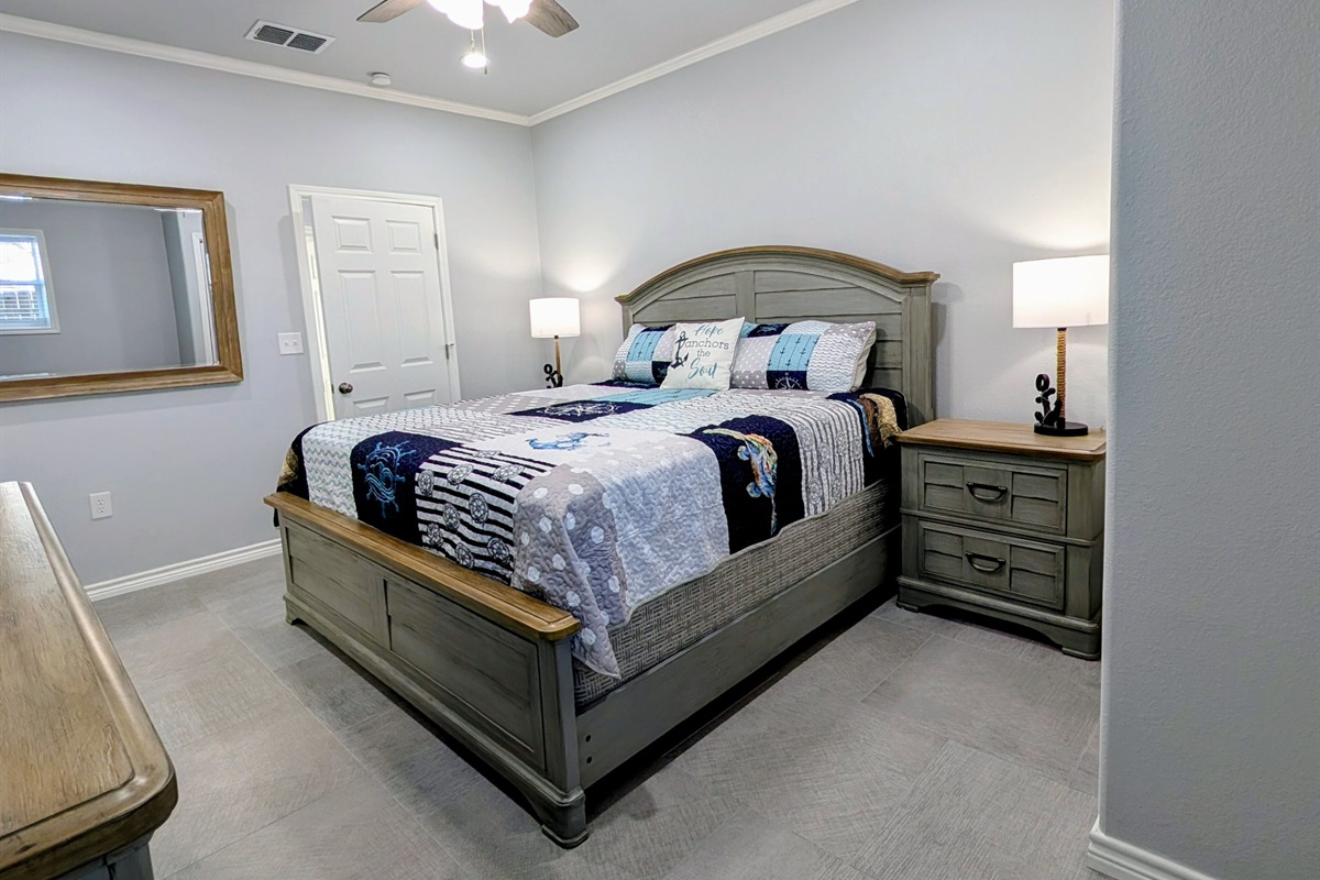 Bedroom two has a king bed, smart tv and ensuite bath