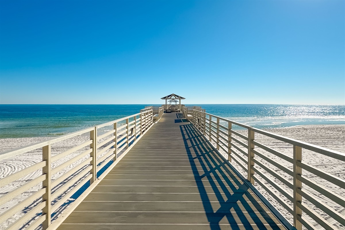 Directly on the sands, this beachfront building offers unparalleled access to the shore and stunning coastal views.