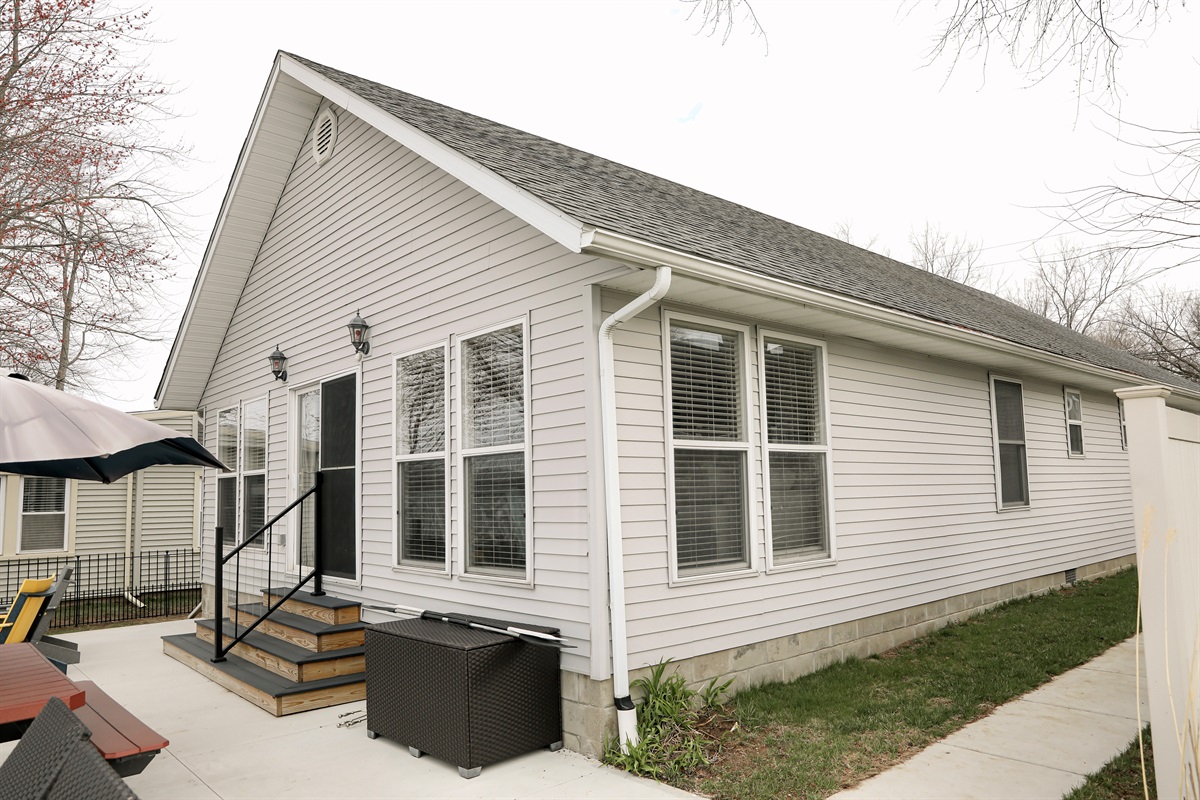 Concrete sidewalk leading to the lake. 