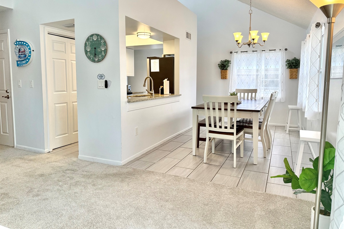 Framed by bright windows, this dining nook is ideal for enjoying morning coffee or leisurely weekend brunch.