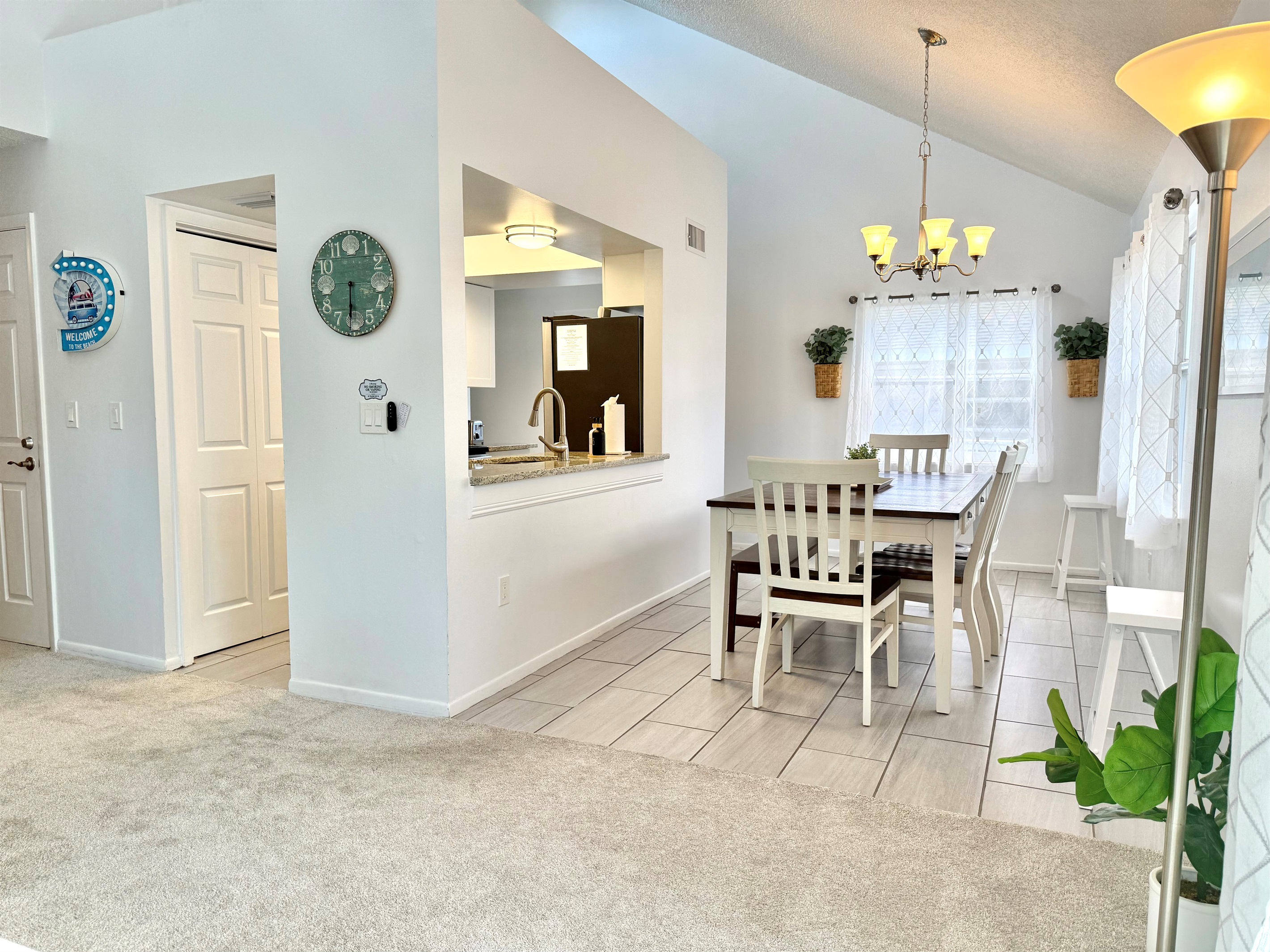 Framed by bright windows, this dining nook is ideal for enjoying morning coffee or leisurely weekend brunch.