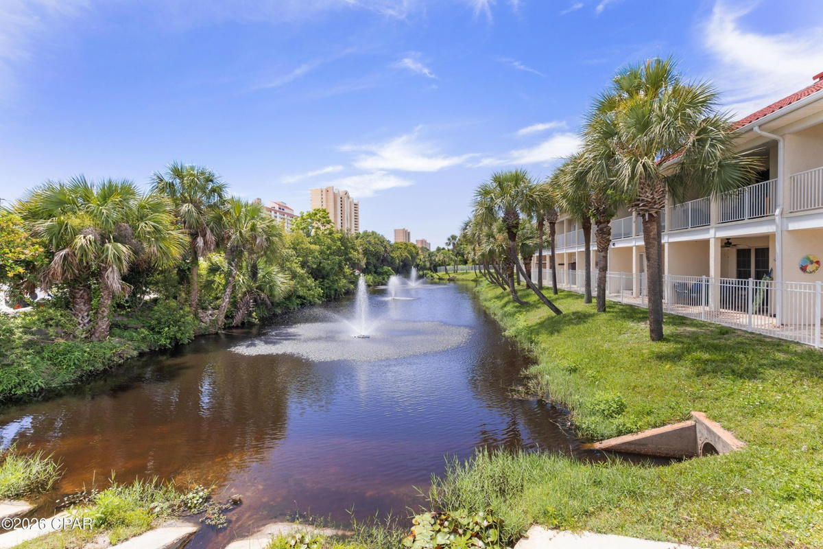 First-floor patio with peaceful lagoon views — perfect for morning coffee or evening unwinding. 