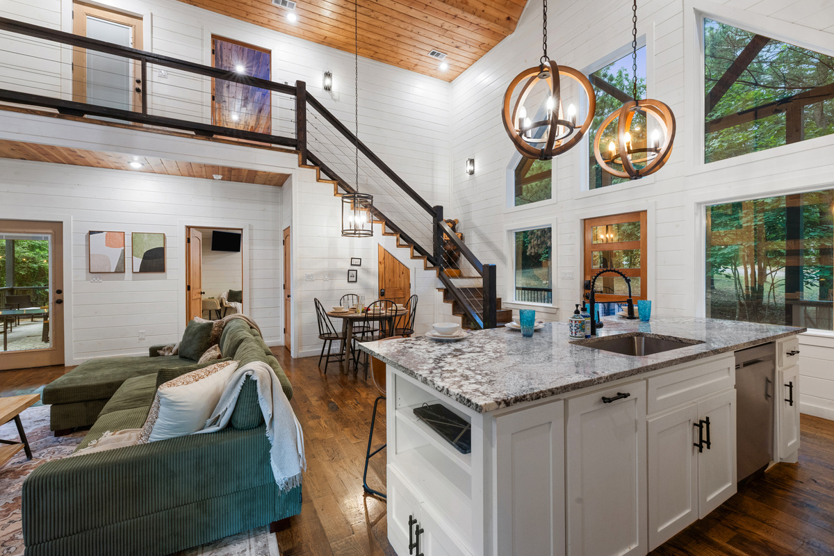 Kitchen island moments made for coffee chats and second helpings. 
Bright, cozy, and wrapped in warm cabin charm, this is where slow mornings and memory making naturally begin.