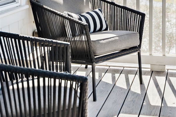 Large screened-in balcony off the second-floor master suite overlooking the private pool and 30A.