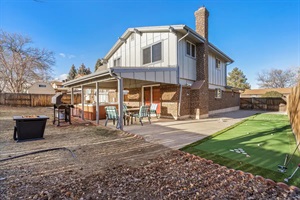 A meticulously maintained backyard, where every blade of grass is perfectly trimmed and every corner radiates serenity, beckoning for moments of peaceful contemplation and outdoor bliss