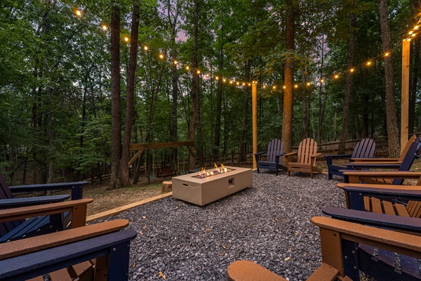 Gather ‘round the fire pit under string lights for s’mores, stories, and stargazing