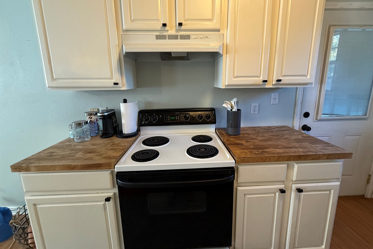 Compact kitchen perfect for light cooking.
