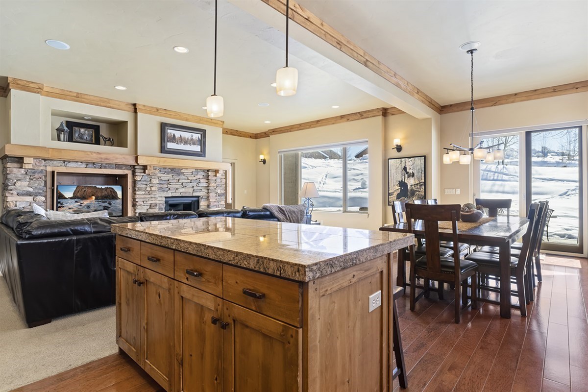 Seamless flow between kitchen, dining, and living spaces keeps everyone connected.