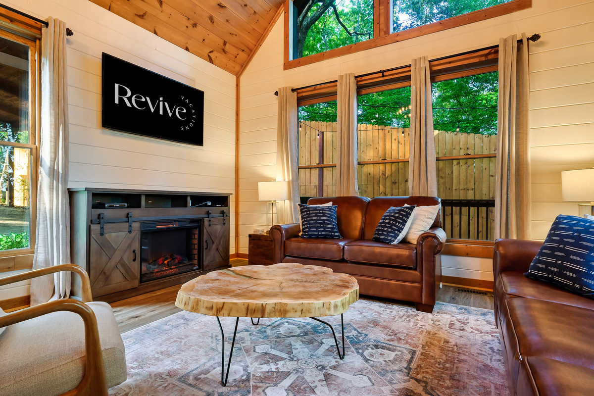 Cozy up by the fireplace while enjoying your favorite shows on TV,