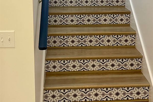 Steps to downstairs.  Photo wall coming soon! Send us your pics