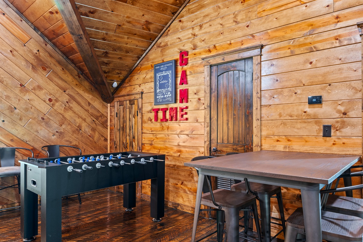 With a game table and extra seating, this area is ideal for friendly competition, board games, or late-night card games with family and friends.
