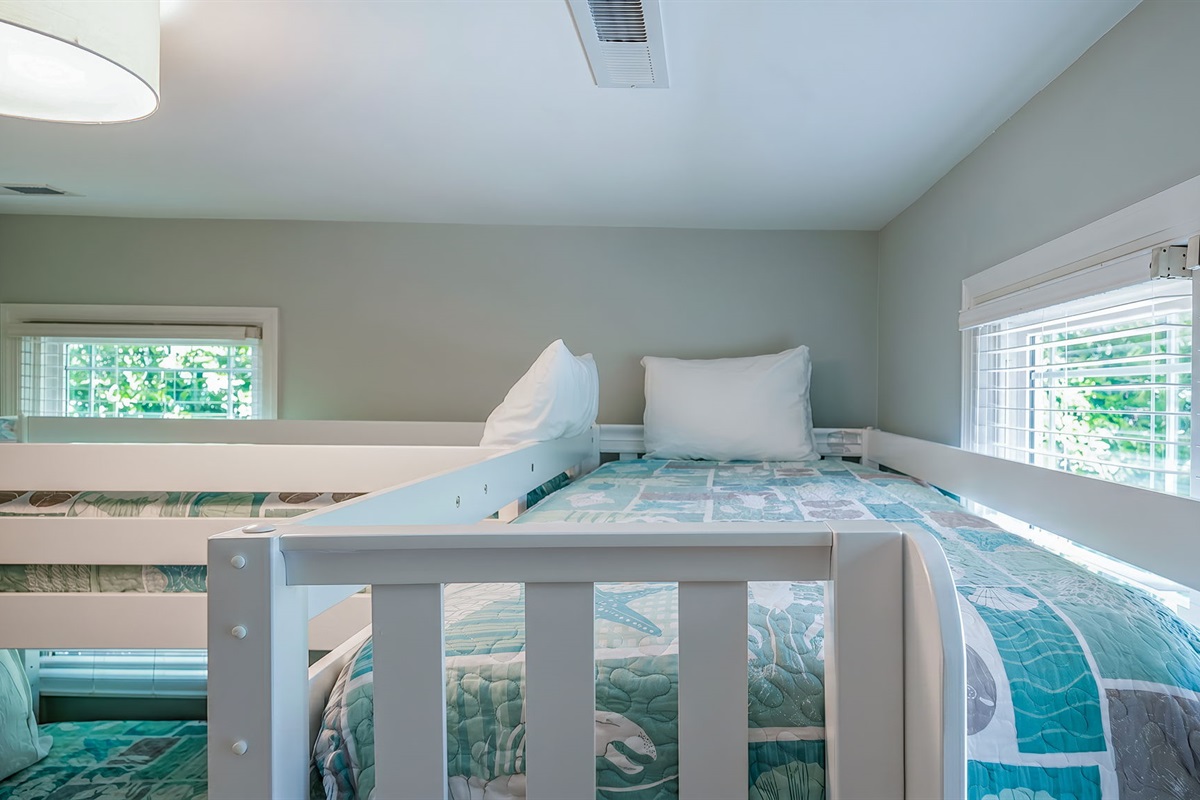 A set of two bunk beds for a fun kid's bedroom!  Updated  beach bedding for a fun retreat! 3705 Hartnett Blvd, Isle of Palms, SC | IOP Escapes