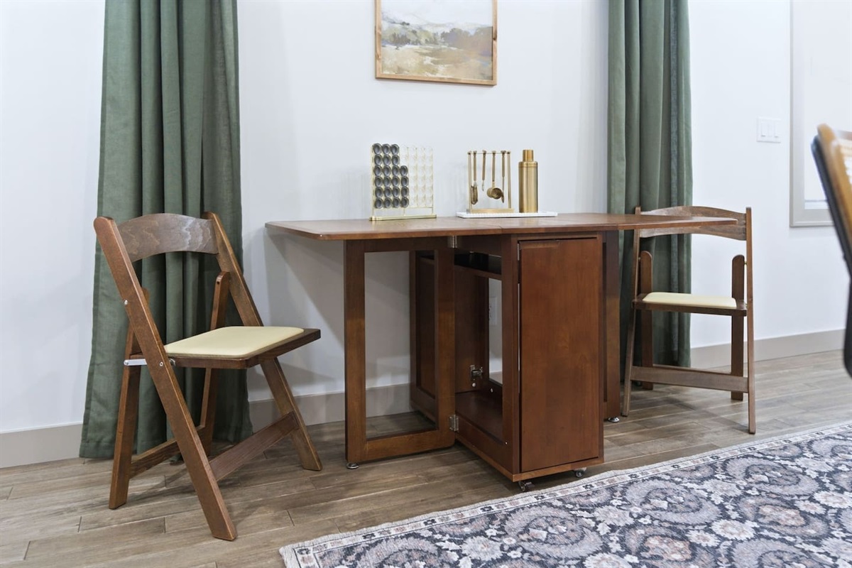 Flexible dining space with a fold-out table that easily expands to accommodate guests when needed.