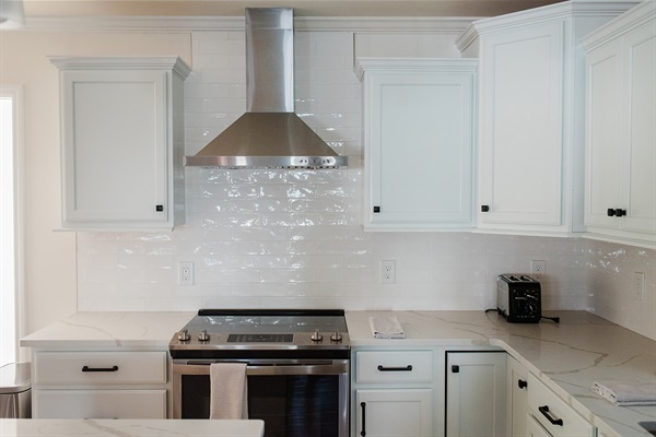 Kitchen with Quartz Counter Tops and GE Appliances