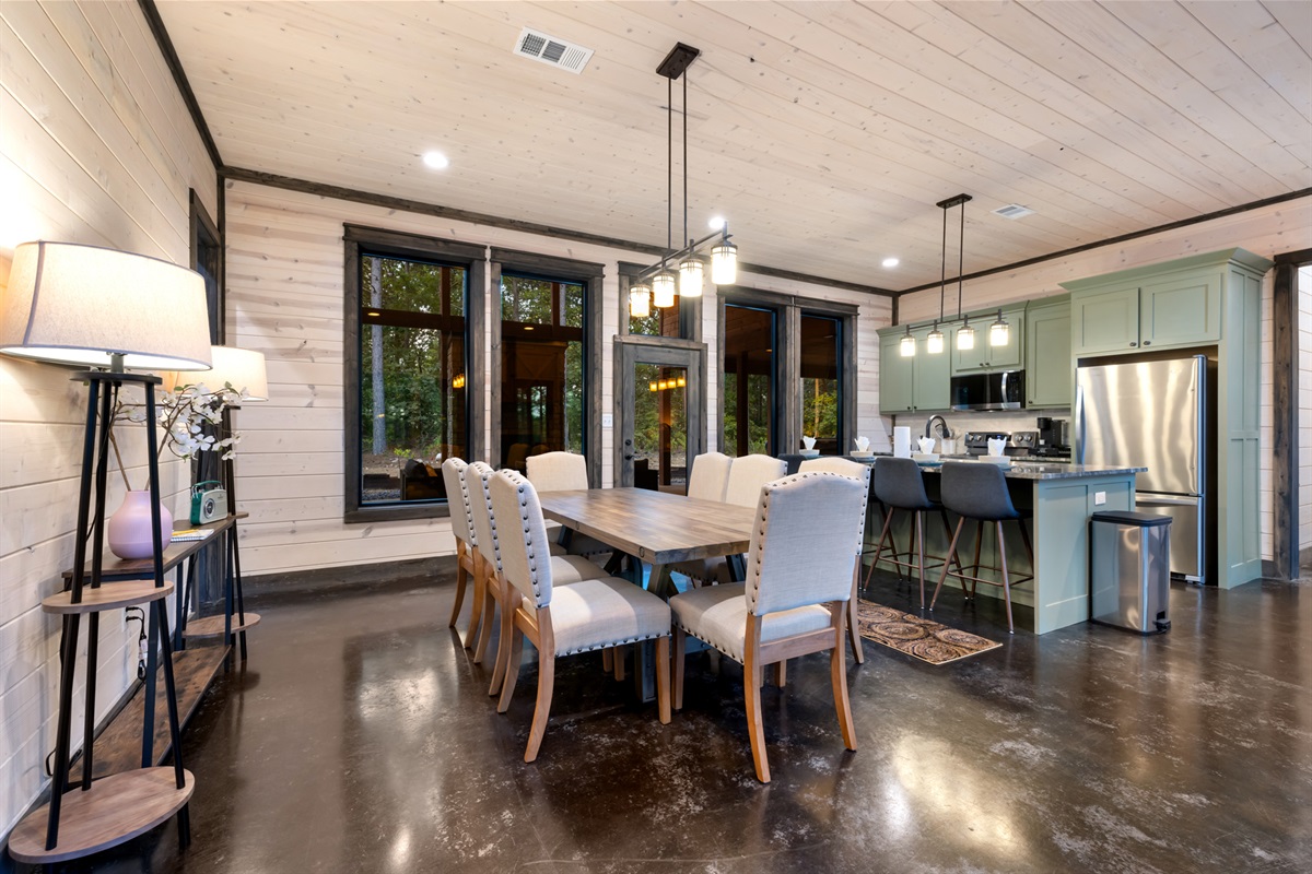 Large dining table with seating for eight, ideal for shared meals, celebrations, and memorable moments with family and friends.